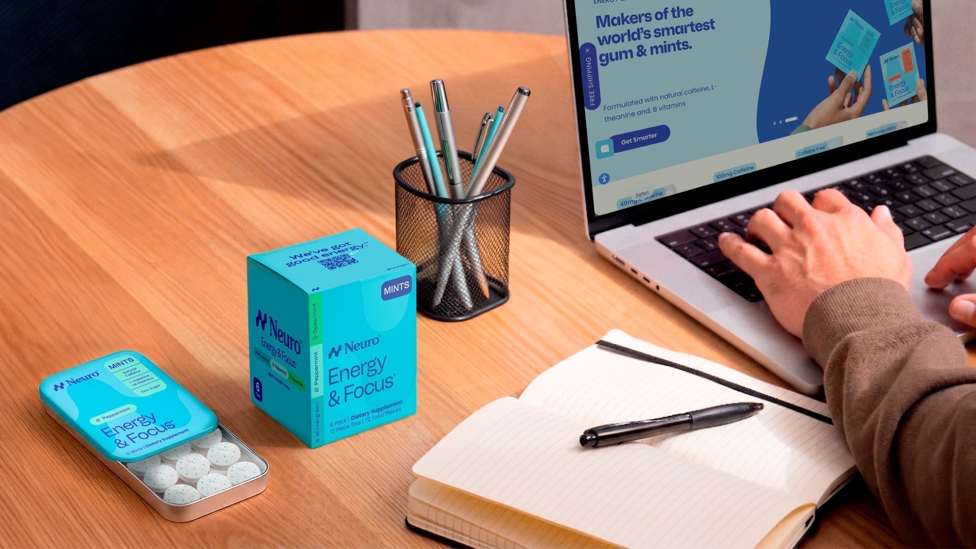 Man working at the office with Neuro Energy & Focus mints on his desk