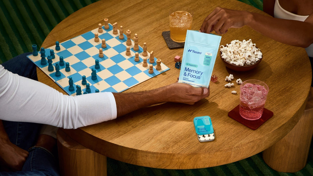 two people playing chess with different Neuro products and flavors on the table